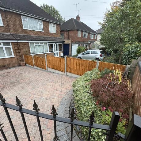 Herringbone block-paved front driveway with new timber fence panels