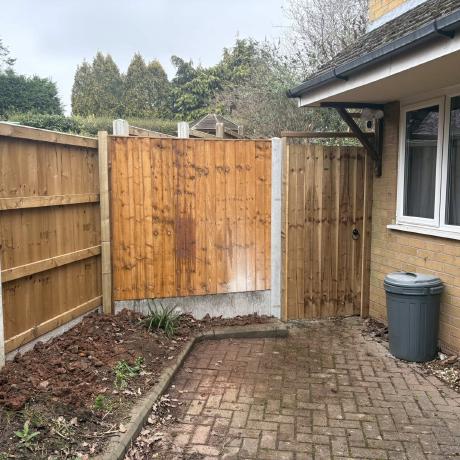 Closeboard fence panels and timber side gate installed at a rear garden