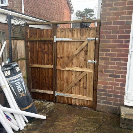 Heavy-duty timber garage gates fitted with galvanised hinges