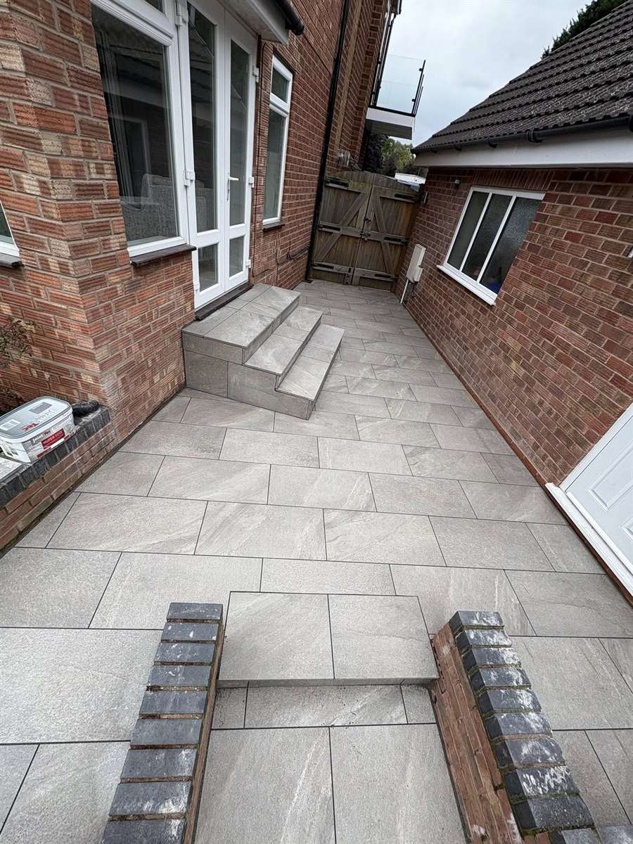 Porcelain patio and steps installed beside French doors in Kingswinford